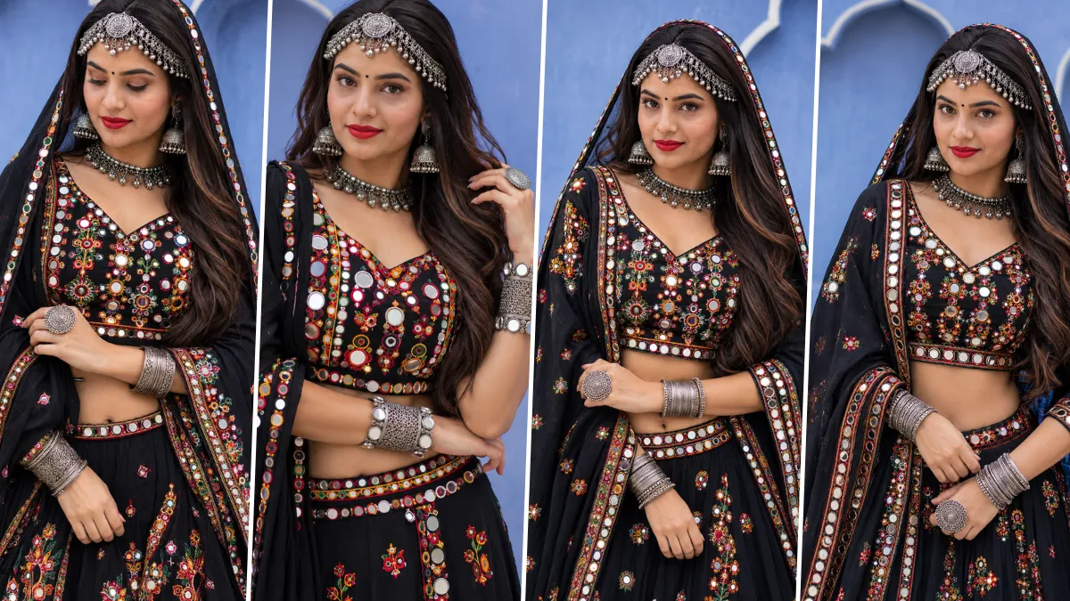 Ultra realistic Indian girl wearing traditional black Navratri chaniya choli with mirror work embroidery and silver jewelry in cinematic ethnic fashion style