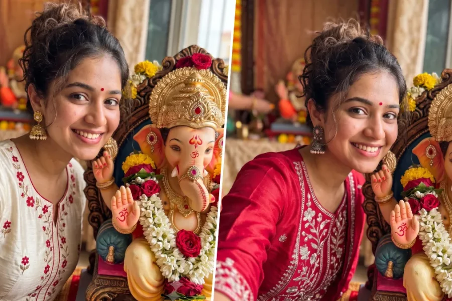 Young Indian woman taking a realistic selfie beside a decorated Lord Ganesha idol during Ganesh Chaturthi
