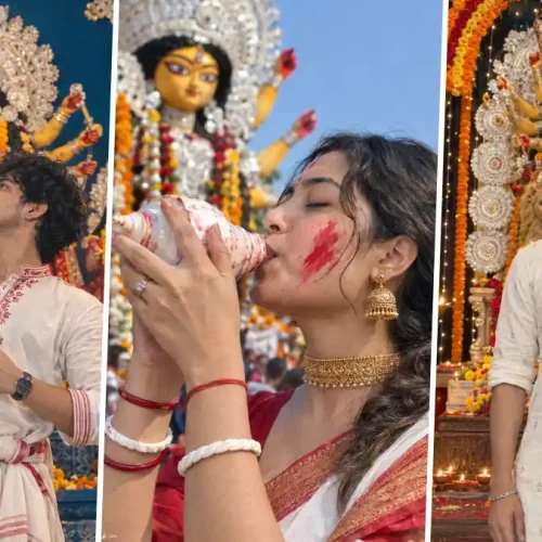 Indian men and women celebrating Durga Puja in traditional Bengali outfits at a decorated Durga idol pandal
